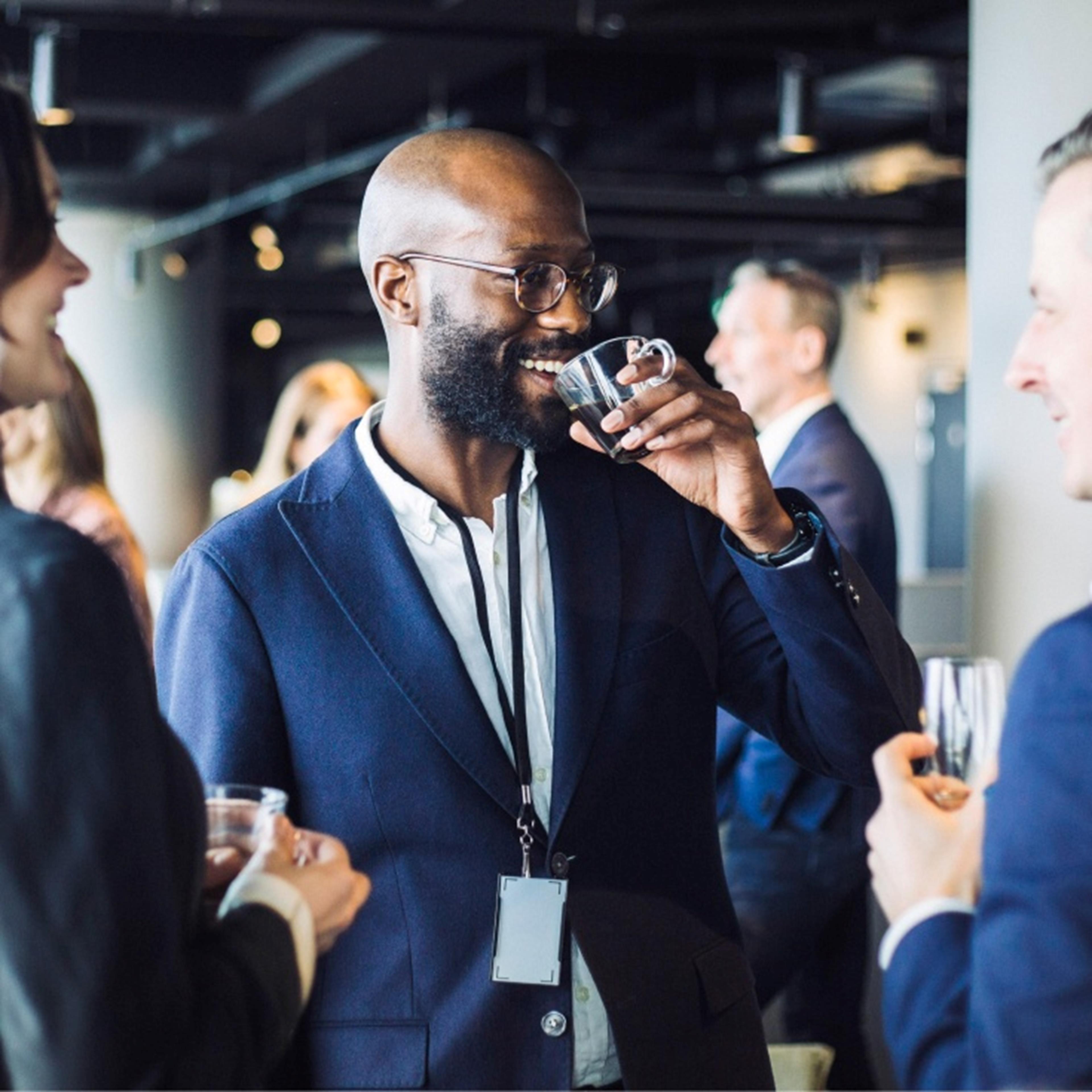 man socializing at a conference